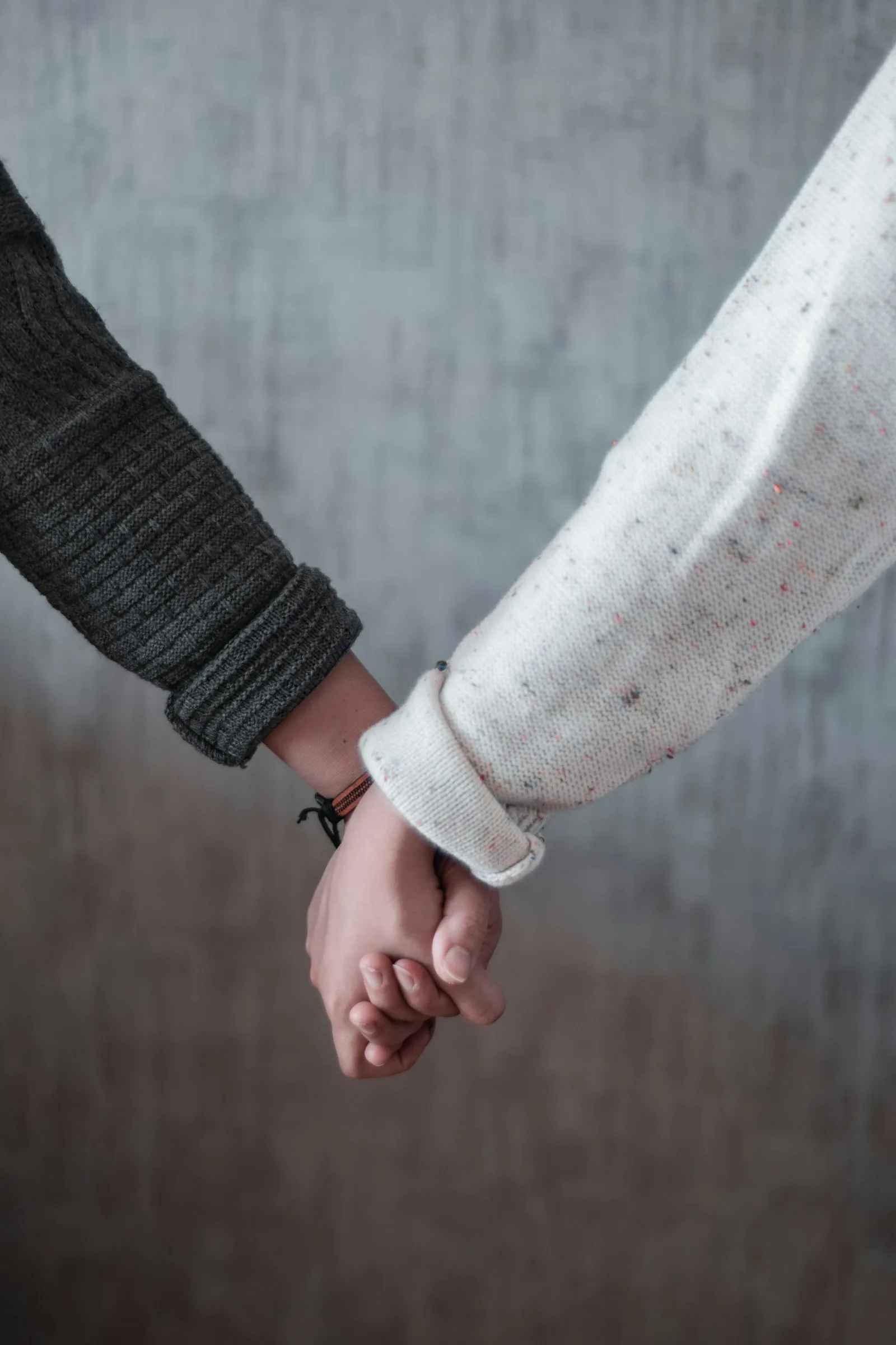 Couple holding hands