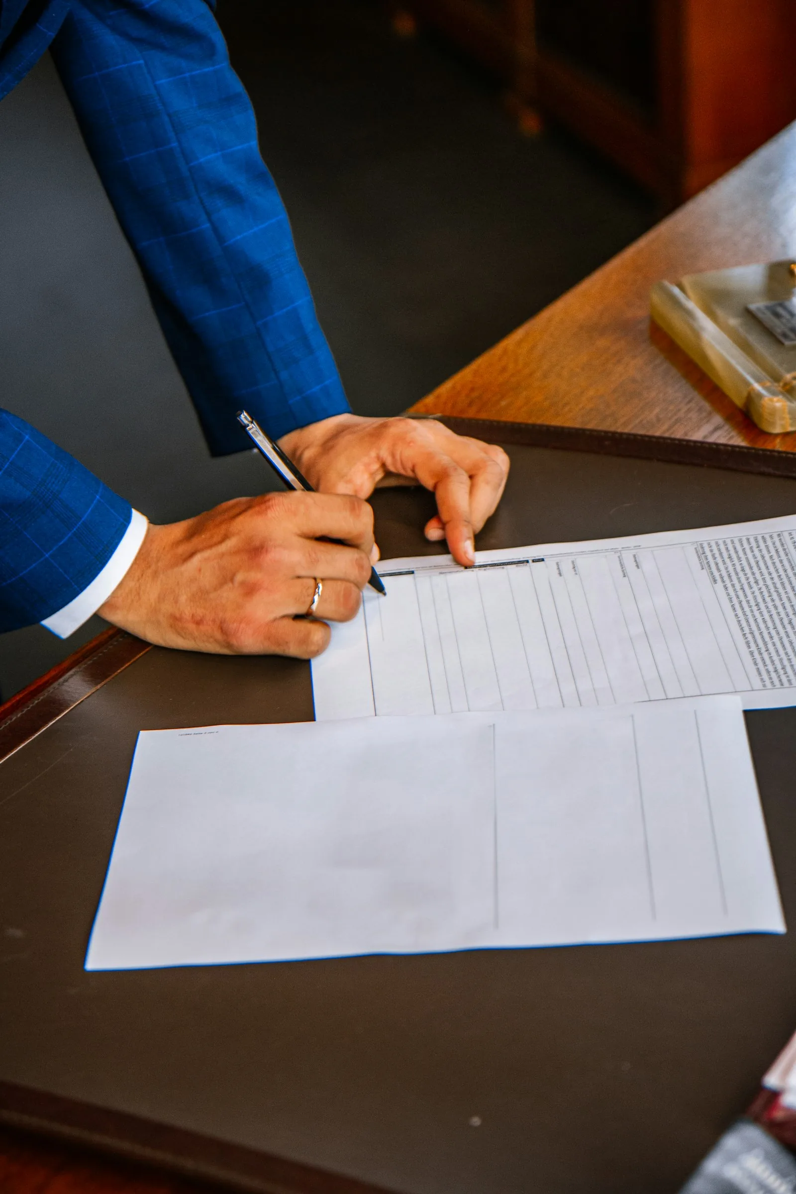 Signing a legal document at a desk